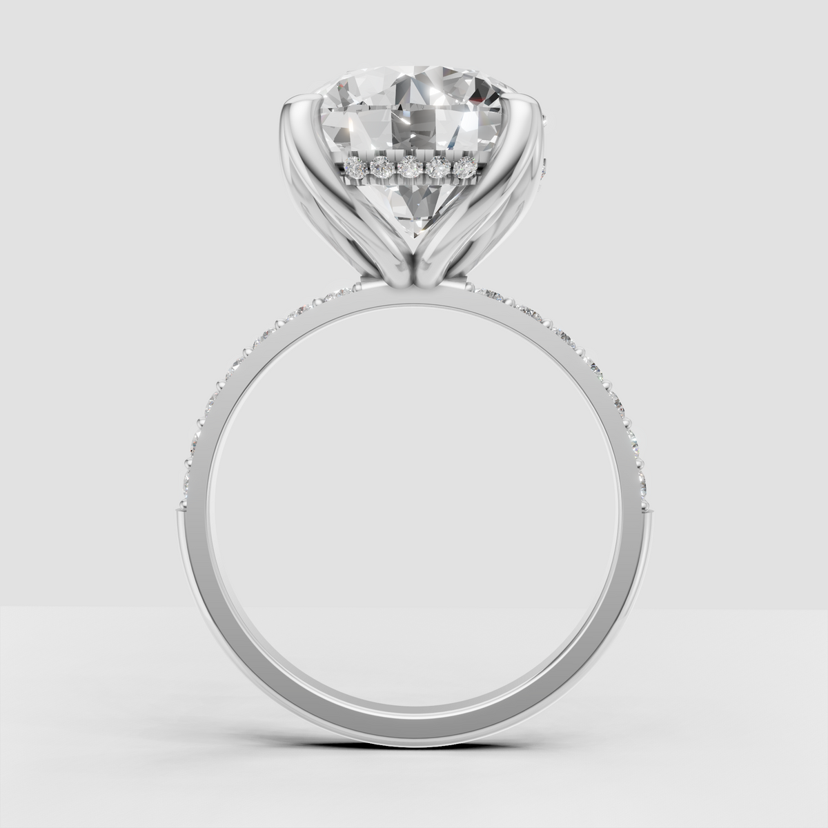 Round diamond ring featuring sculpted split-style shoulders