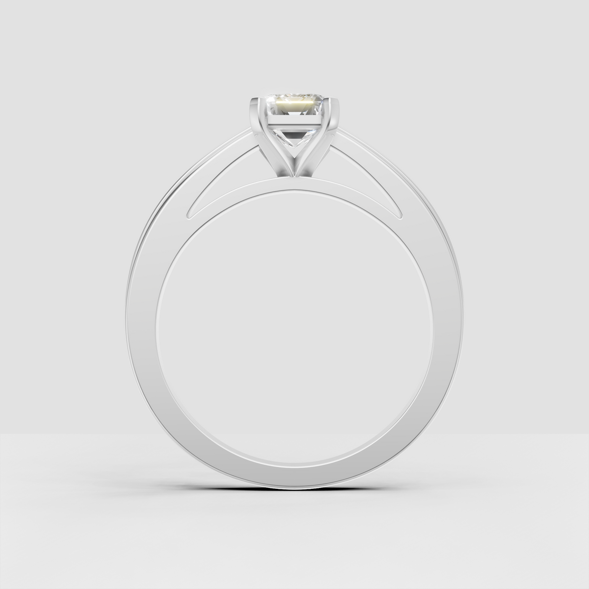 Classic emerald cut engagement ring with split shoulder design