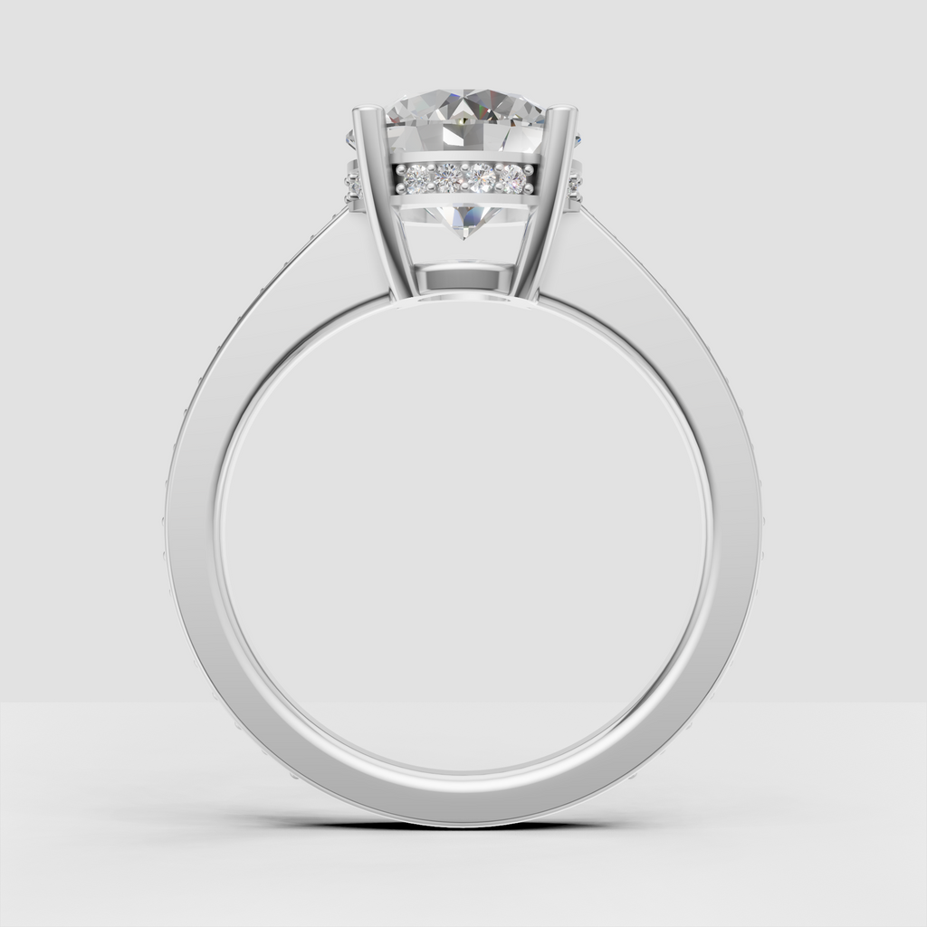 Close-up round diamond engagement ring with hidden halo detailing.