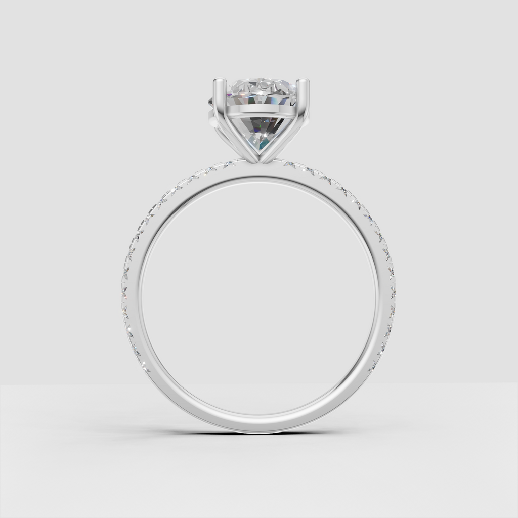 Yellow gold cathedral engagement ring with oval center stone