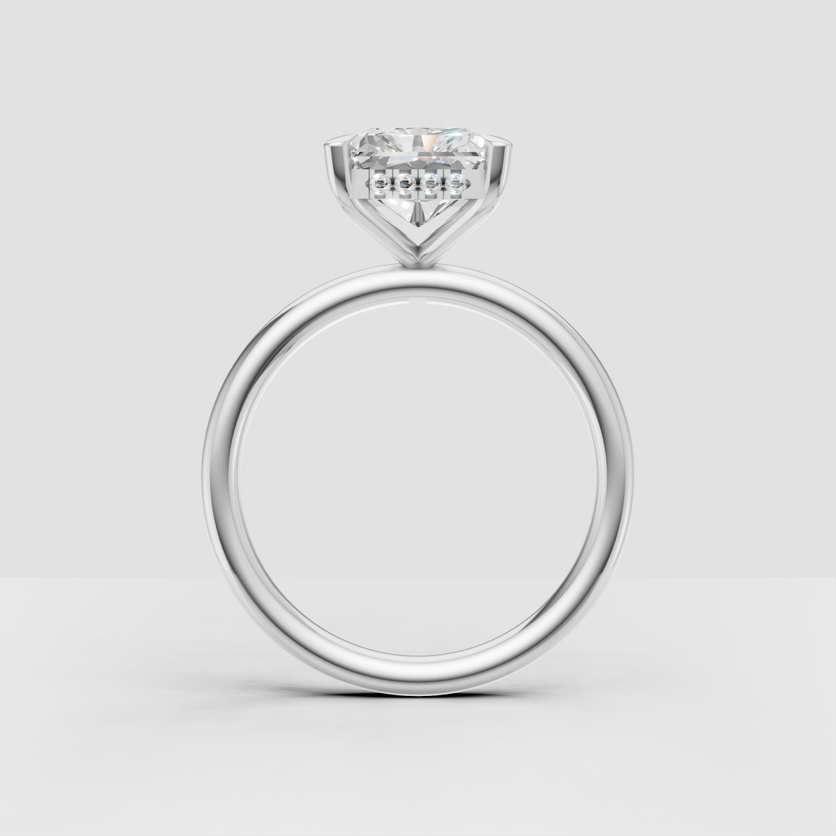 Radiant diamond engagement ring with hidden halo accent stones