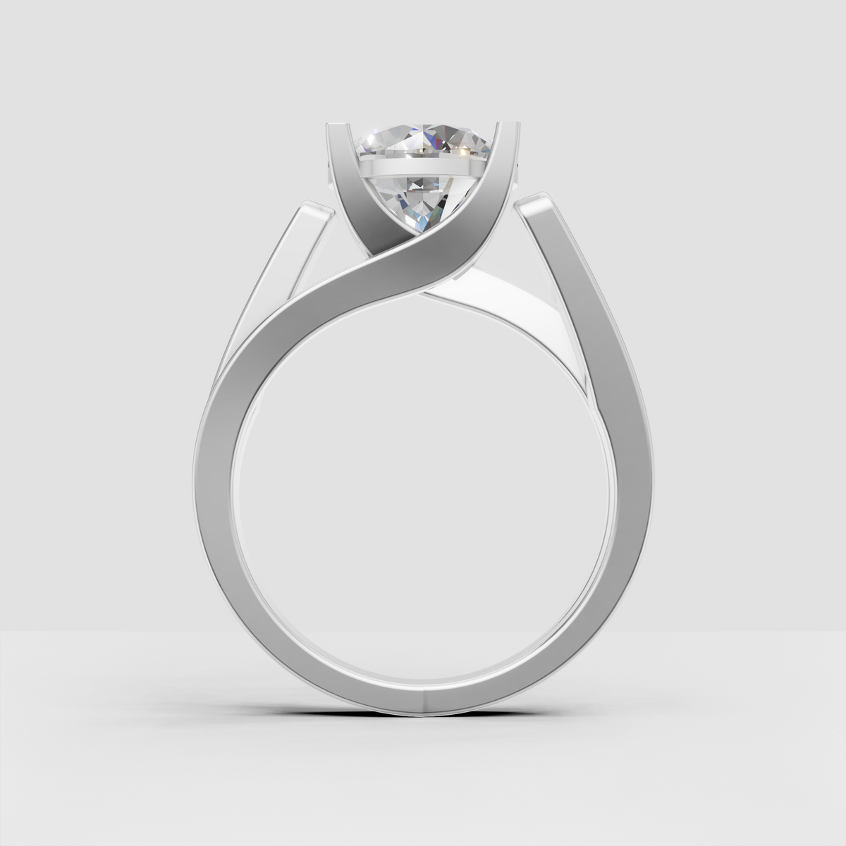 Round diamond ring featuring a four-prong elevated basket setting
