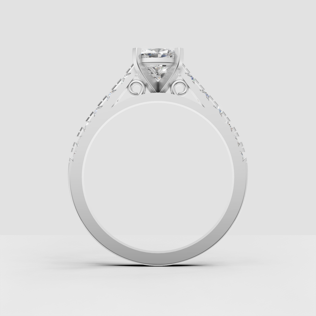Cushion diamond engagement ring with round diamonds along polished shoulders