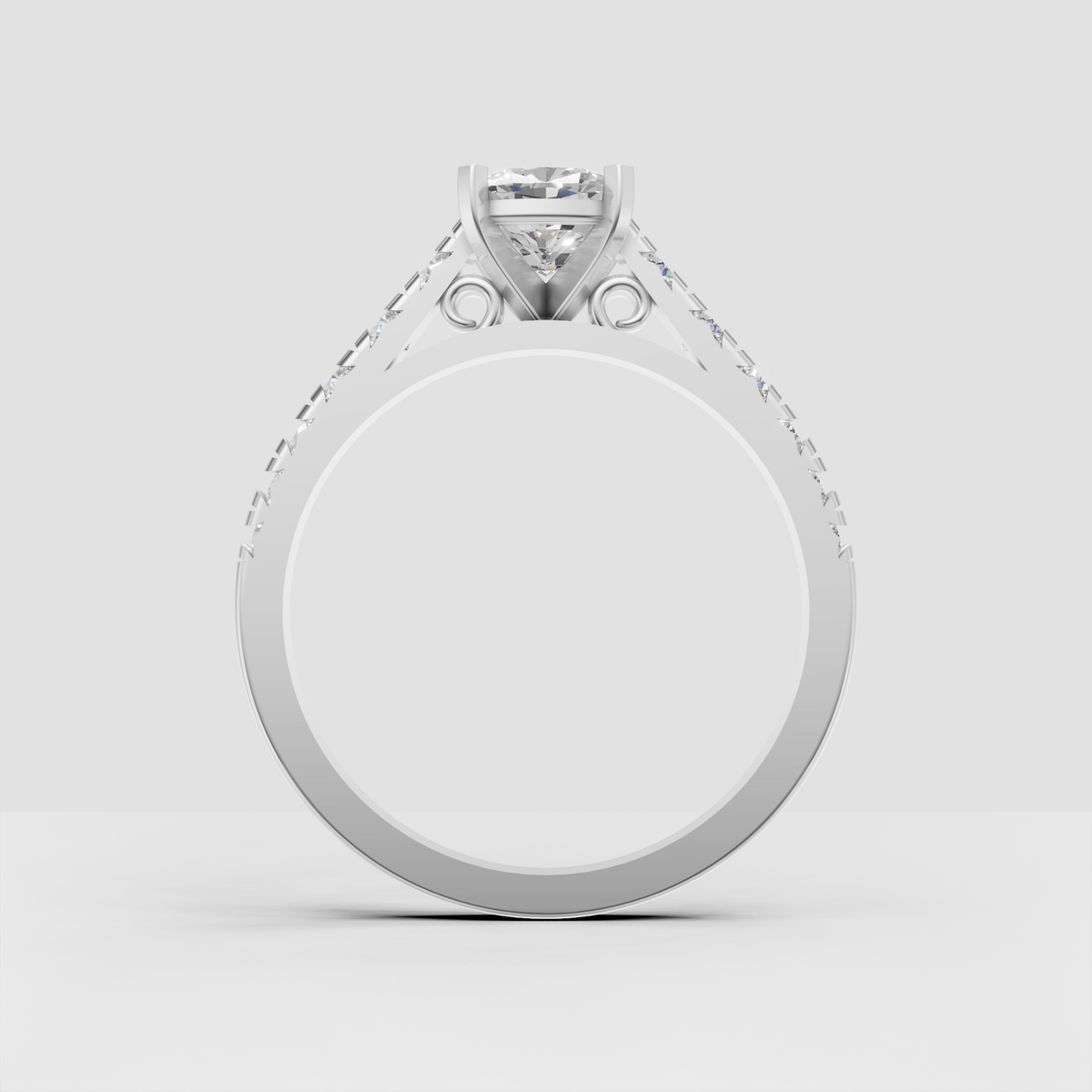 Cushion diamond engagement ring with round diamonds along polished shoulders