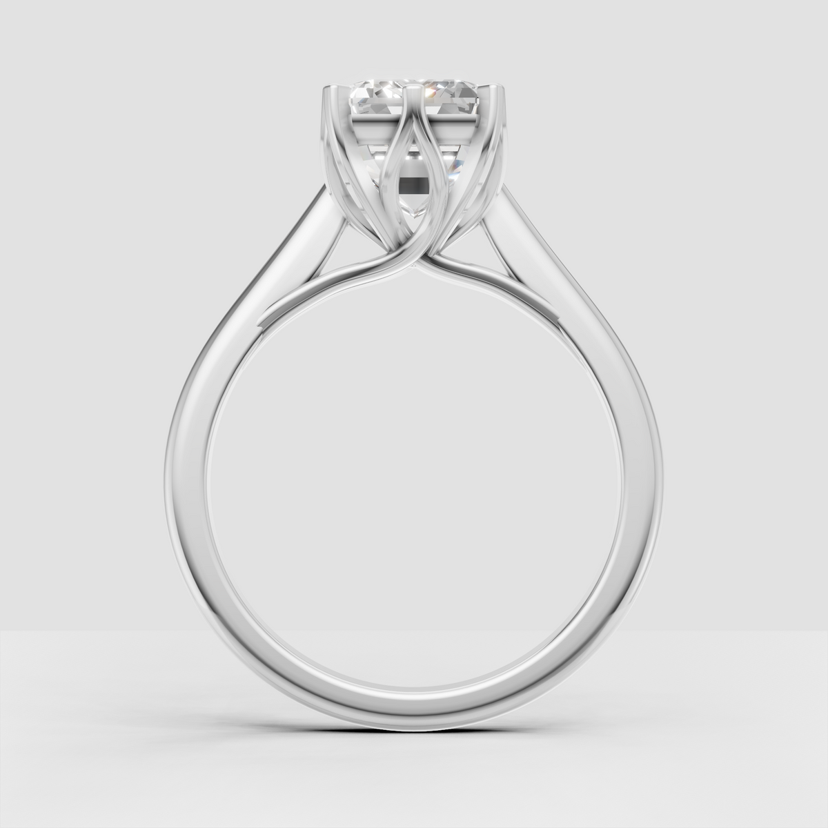 Yellow gold rectangular emerald cut engagement ring