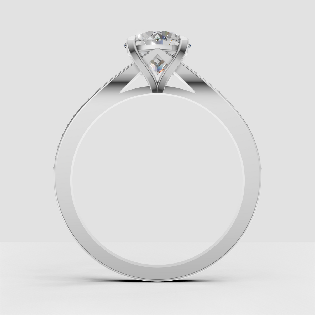 Round diamond ring featuring pavé-set shoulder stones