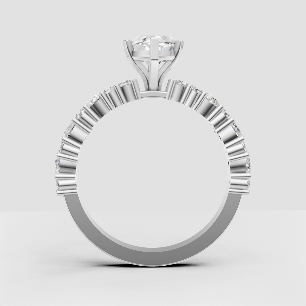 Marquise engagement ring with pavé-style side stone detailing and polished band