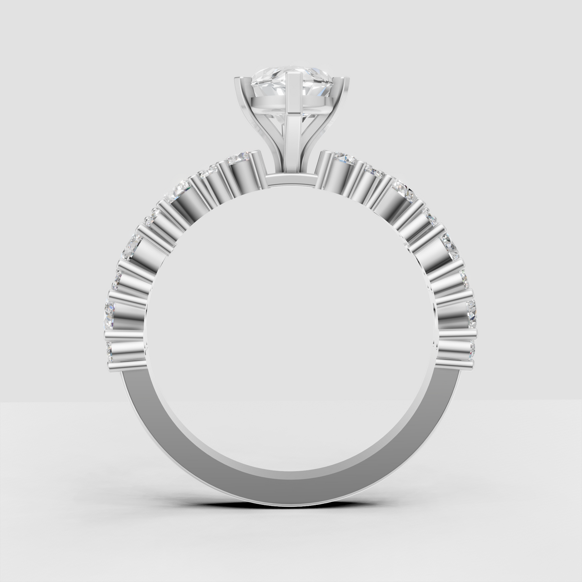 Marquise engagement ring with pavé-style side stone detailing and polished band