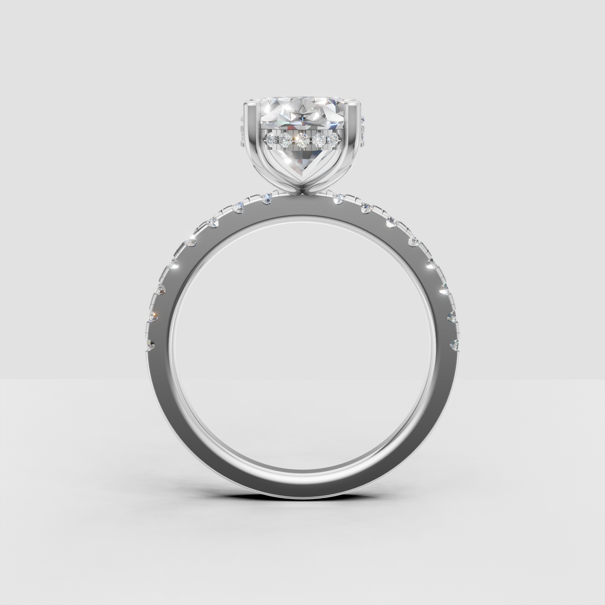 Oval diamond hidden halo ring with diamond accented shoulders