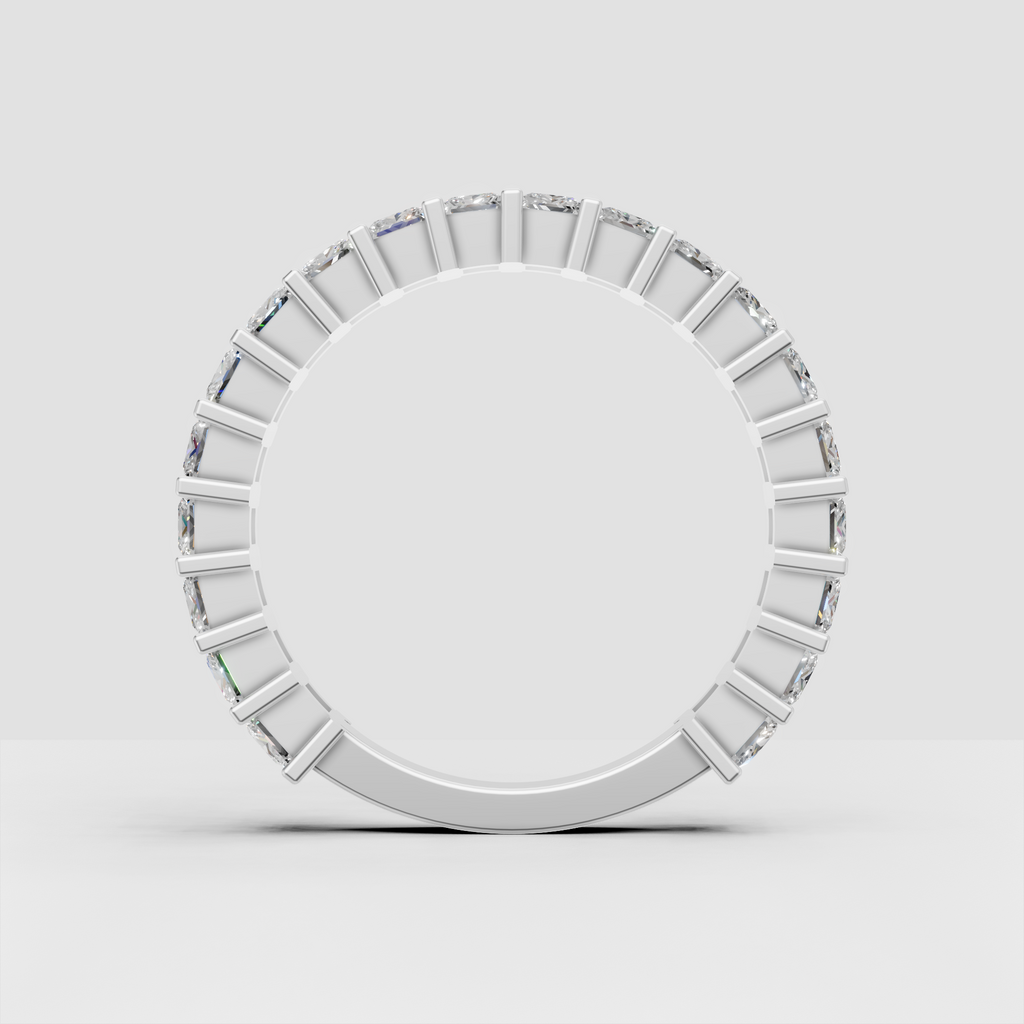 Side view of cushion cut diamond eternity band in gold