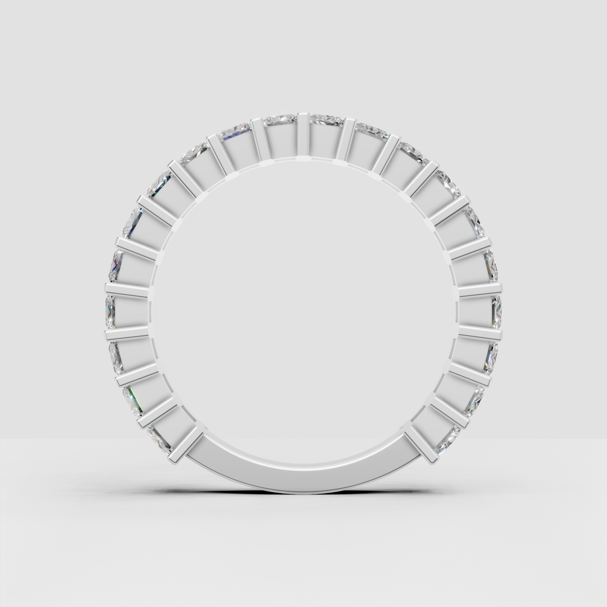 Side view of cushion cut diamond eternity band in gold
