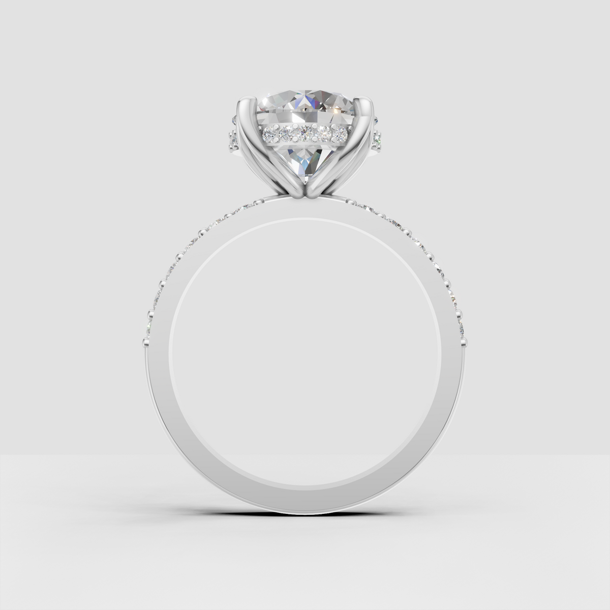 Classic round diamond solitaire ring with crossover shoulders