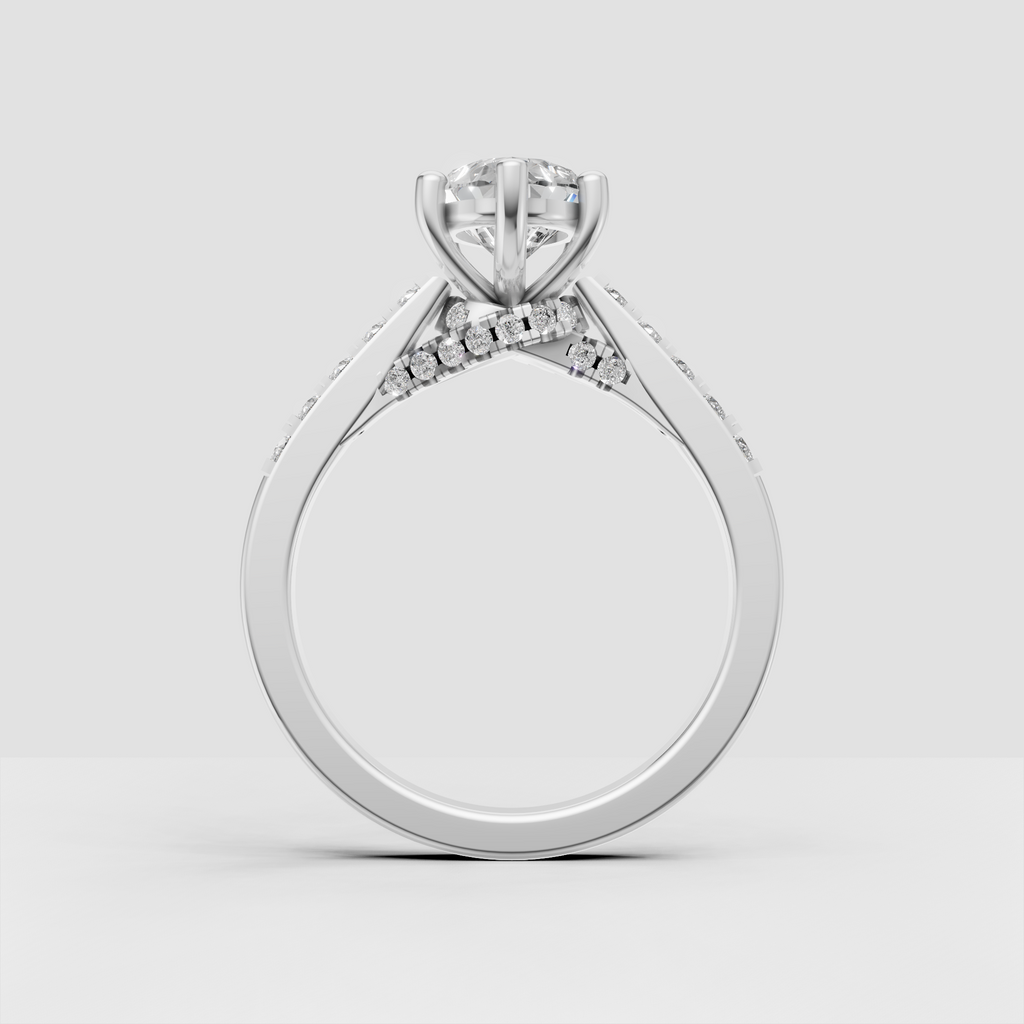 Gold pear cut engagement ring with round diamond accented shoulders