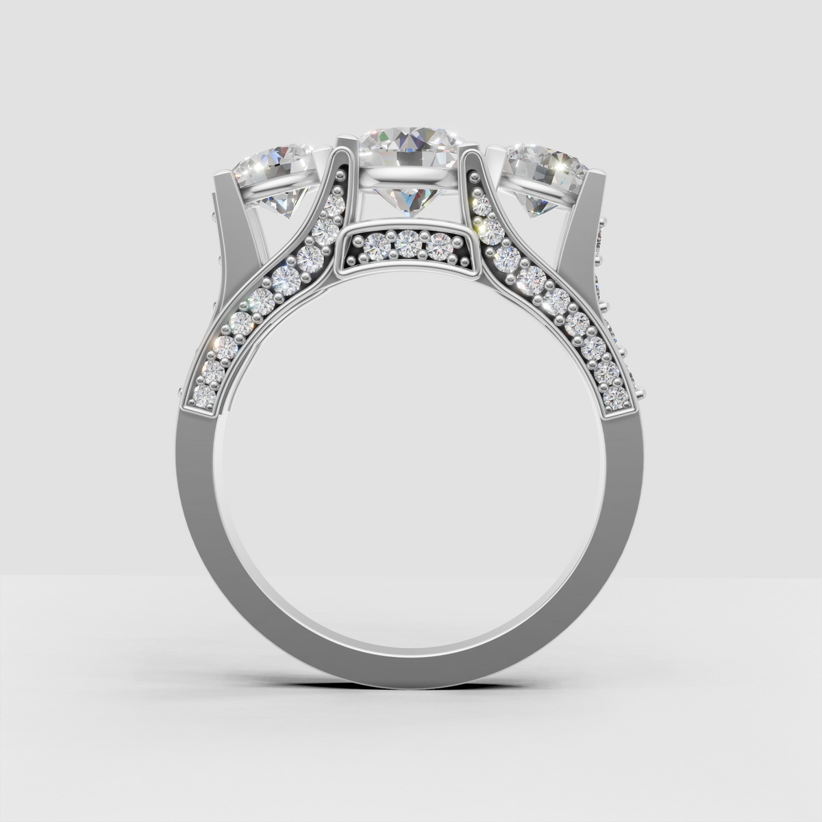 Round Diamond engagement ring featuring a three-stone pavé design