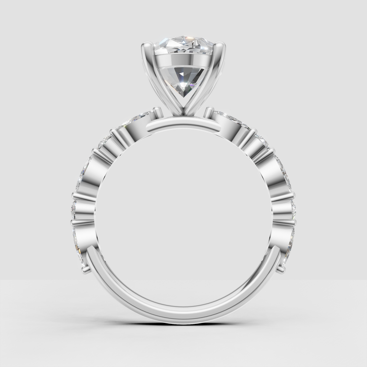 Oval center stone with sparkling diamond shoulders
