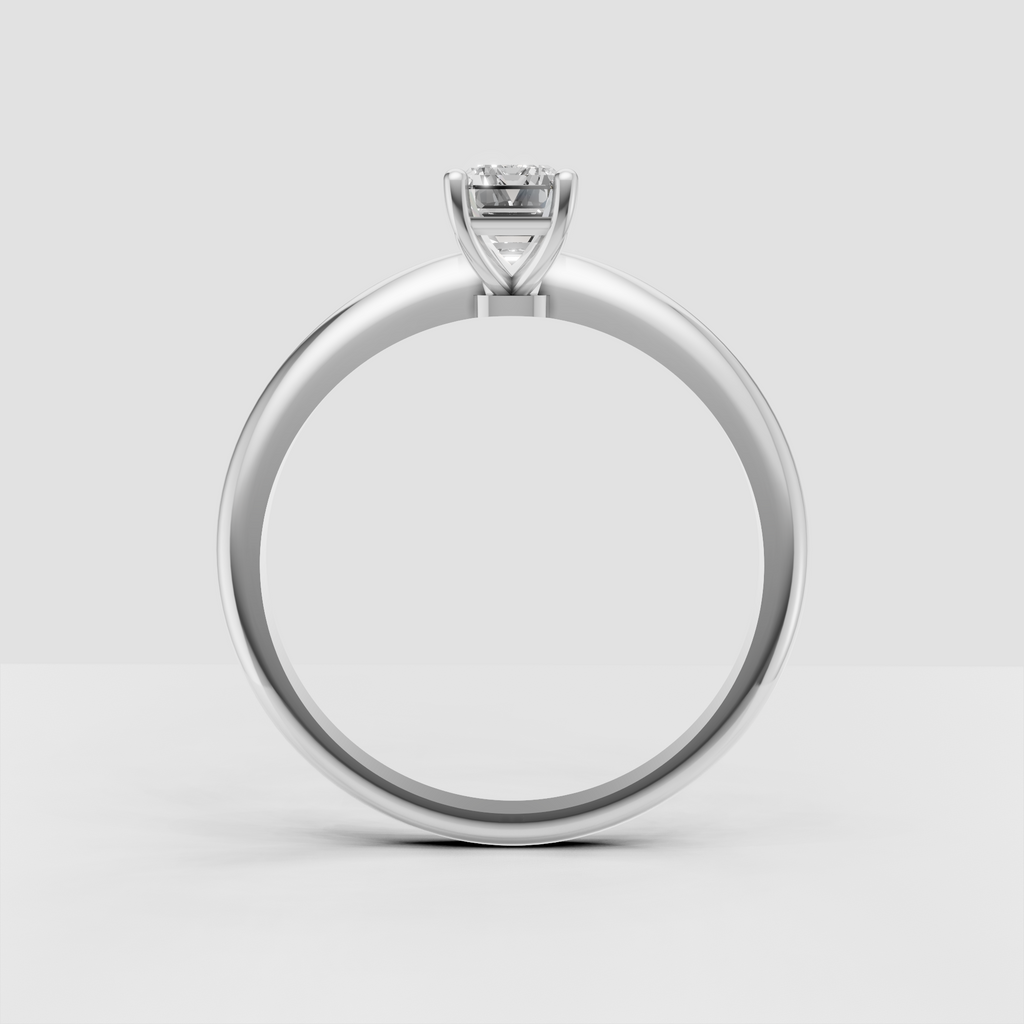 Emerald cut diamond ring featuring rounded claw prongs