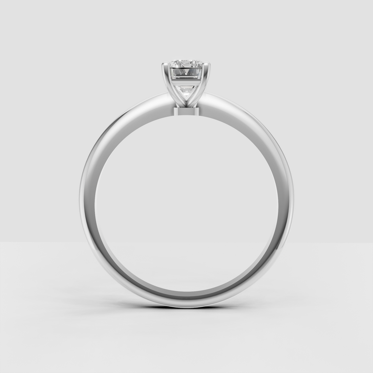 Emerald cut diamond ring featuring rounded claw prongs