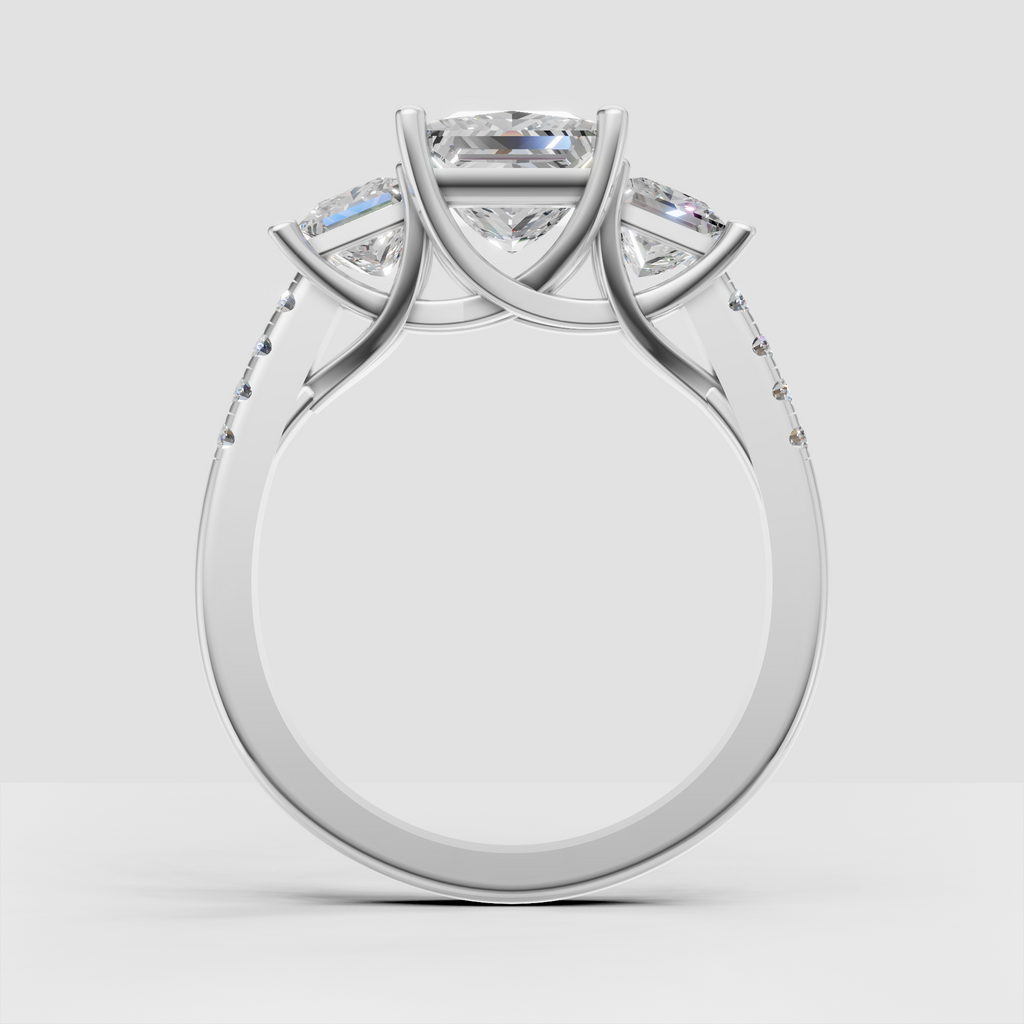 Square diamond three-stone engagement ring with sculptural prong basket setting