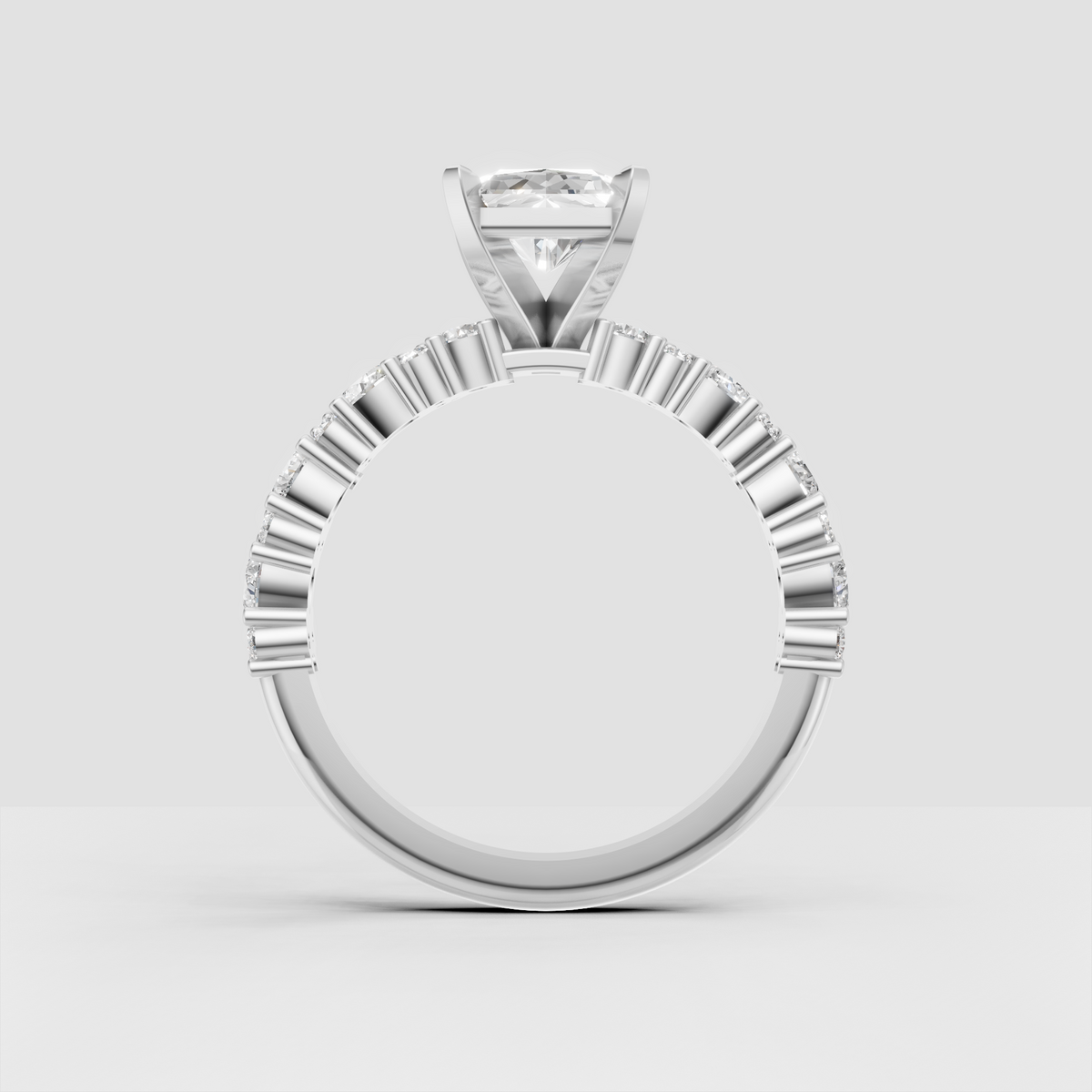 Radiant cut solitaire ring with sparkling round accent diamonds in gold