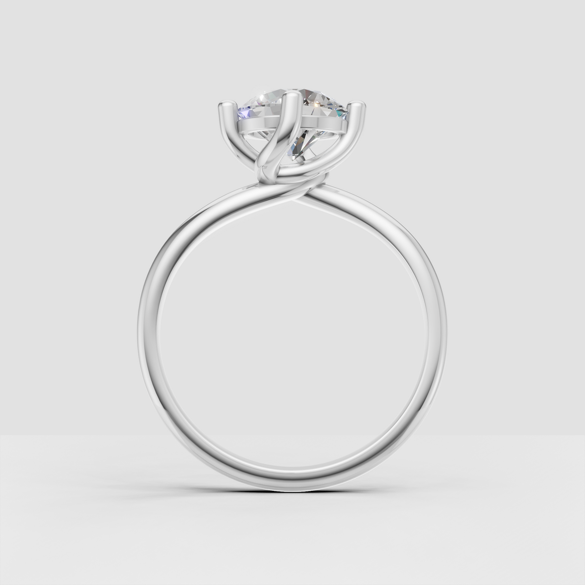 Brilliant round diamond ring with intertwined polished band