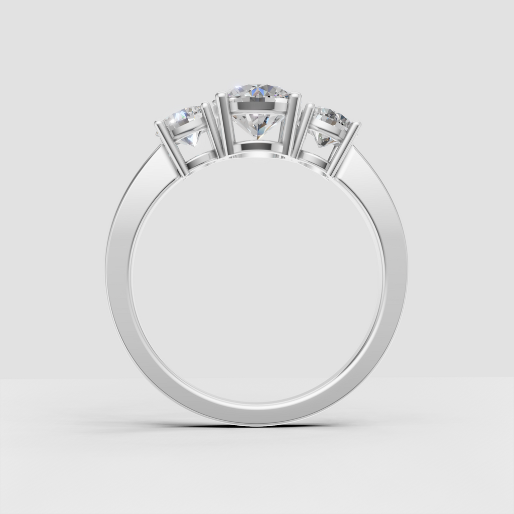 Side view of round Diamond three-stone engagement ring in yellow gold