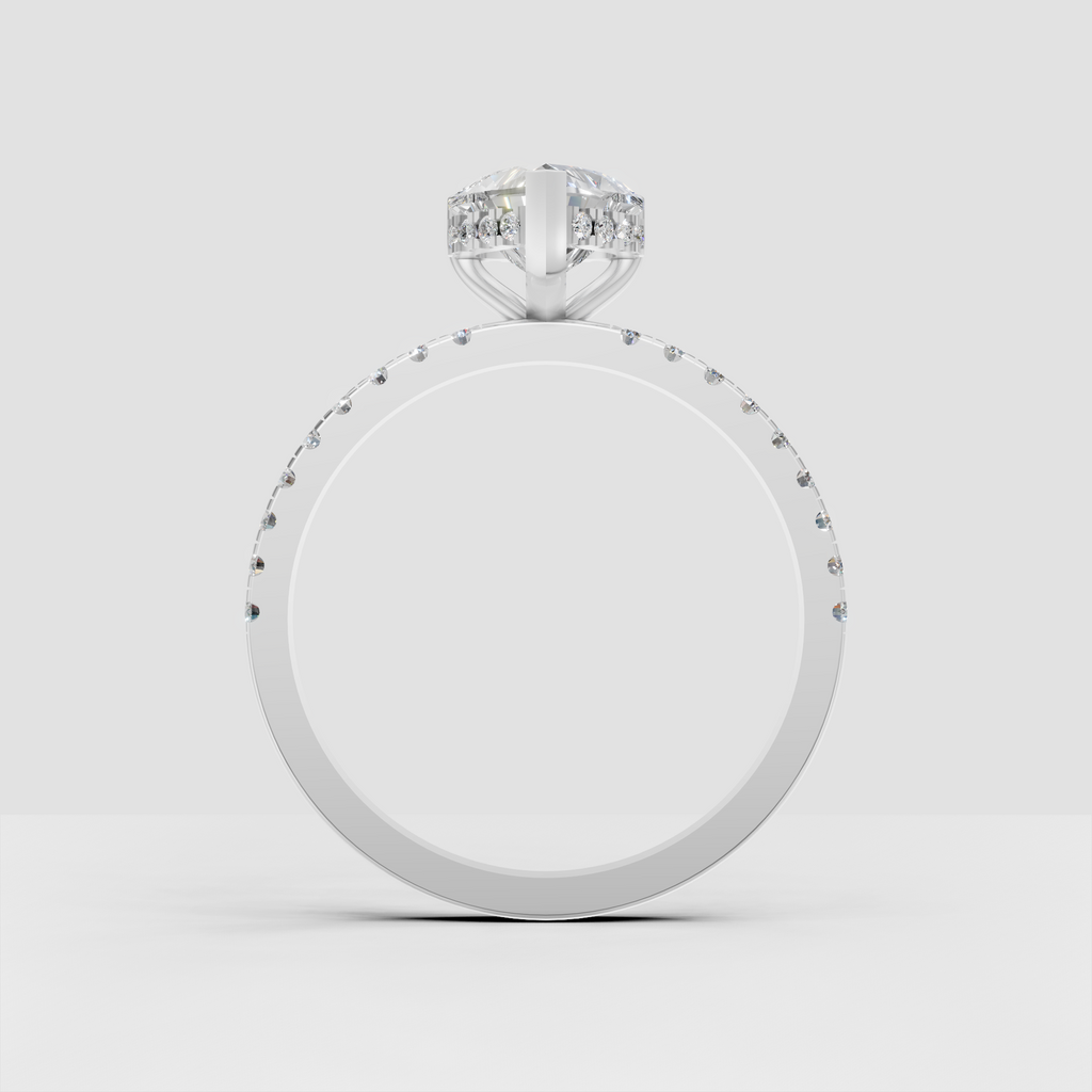 Heart shaped center diamond in an elevated prong setting