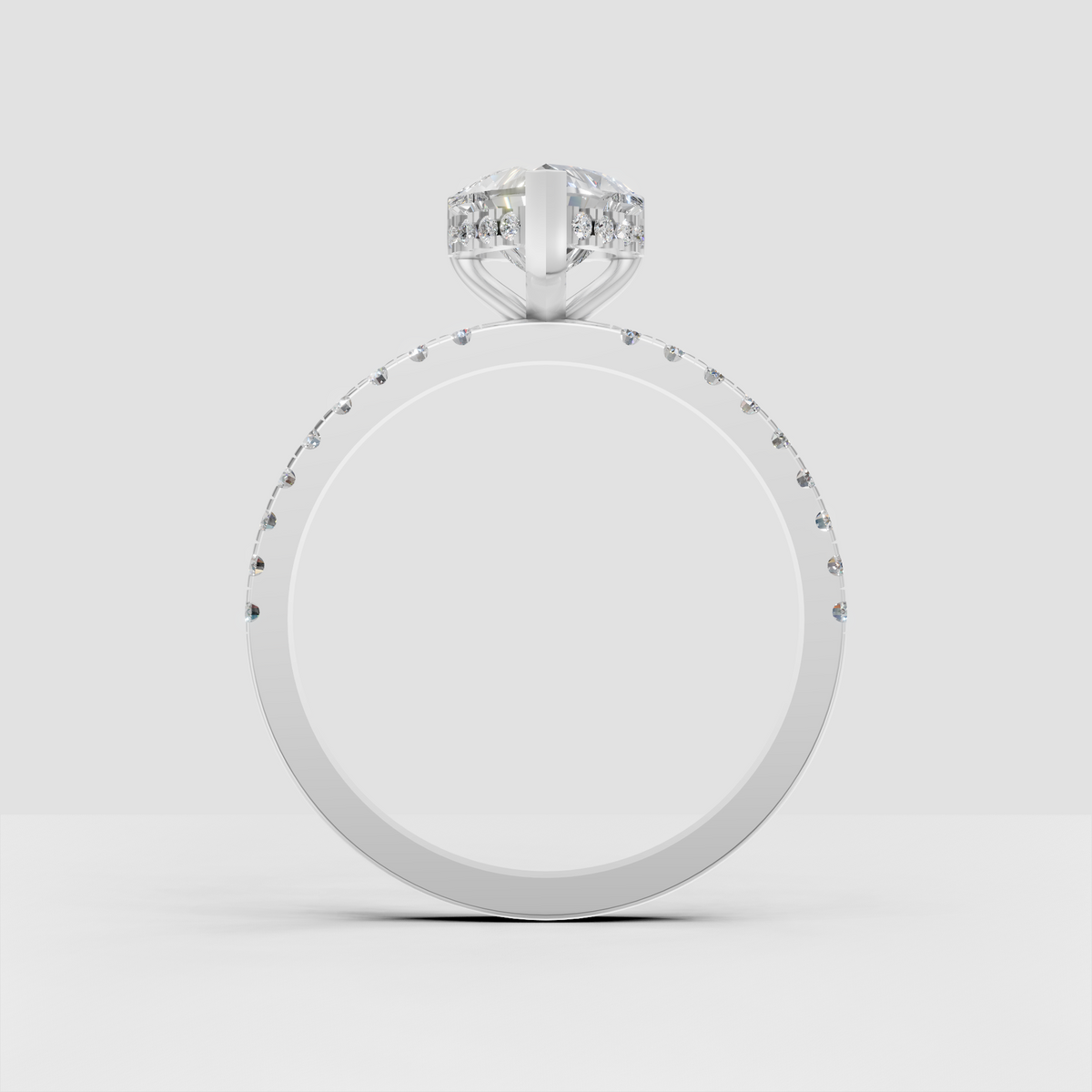 Heart shaped center diamond in an elevated prong setting