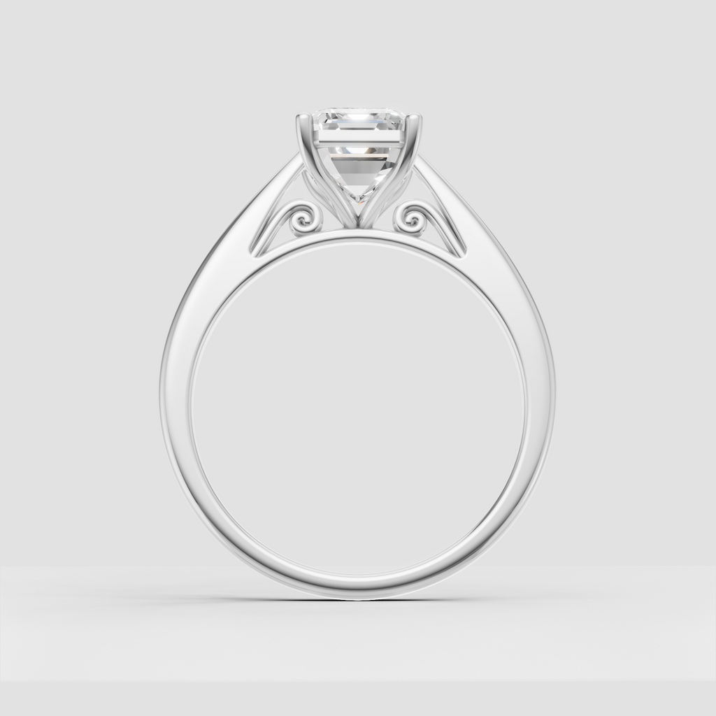 Emerald cut solitaire ring with decorative gallery