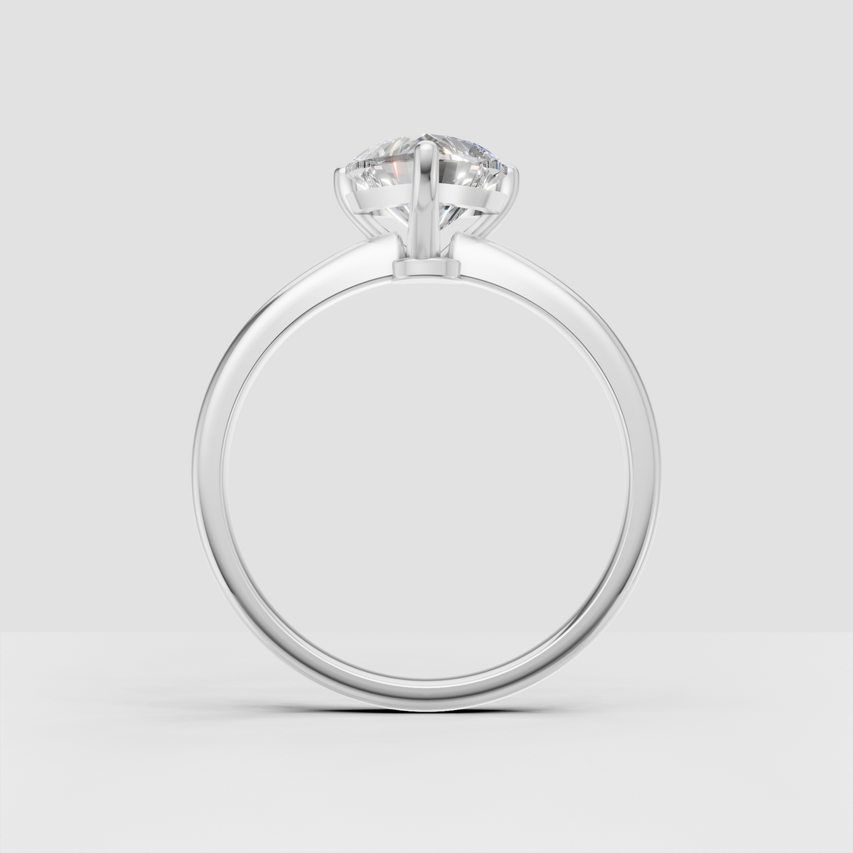 Elegant heart shaped diamond ring with elevated three prong setting