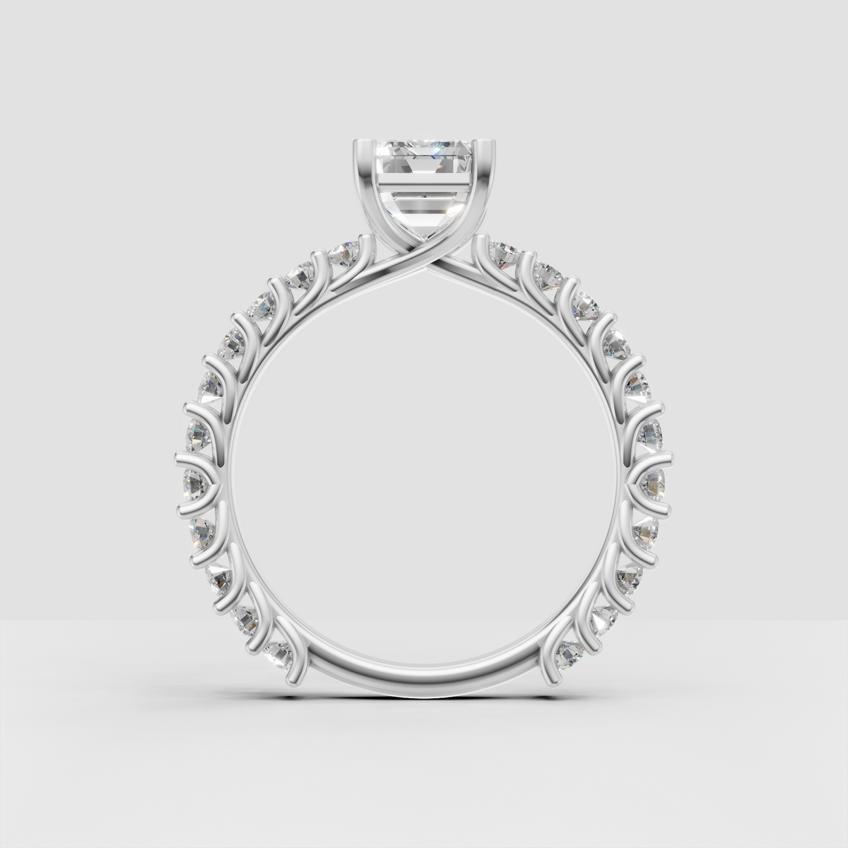 Emerald cut center diamond with sparkling pave band