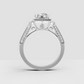 Four-prong round diamond engagement ring with diamond-encrusted halo