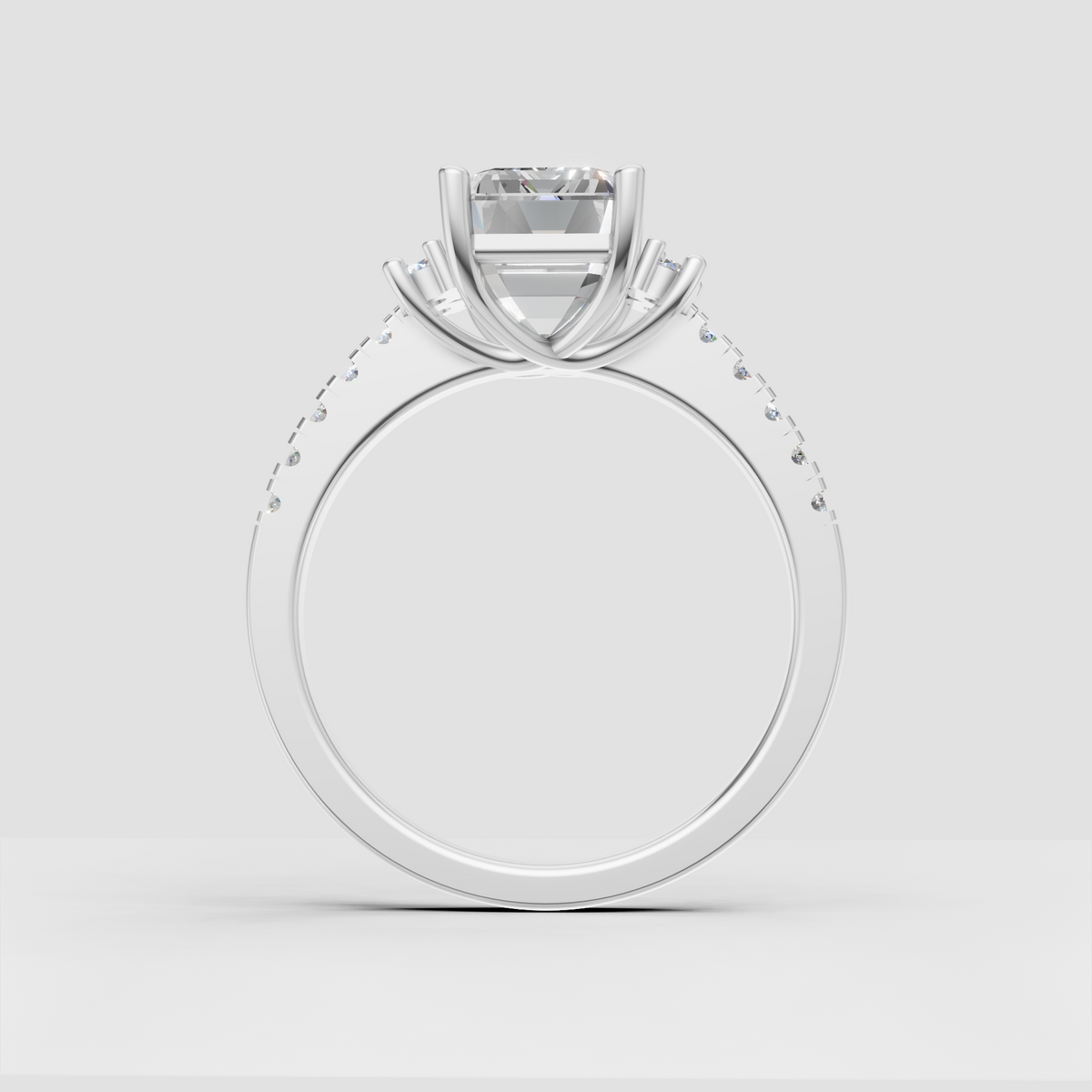 Emerald cut engagement ring with pave diamond shoulders