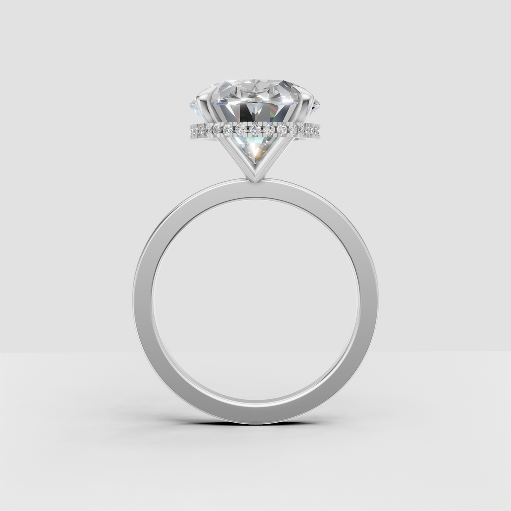 Classic gold oval diamond engagement ring with hidden halo