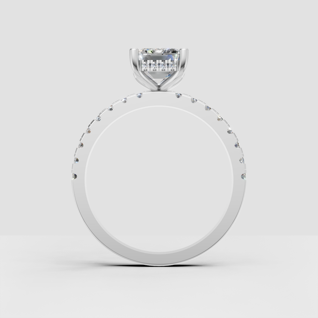 Step-cut emerald diamond ring with pavé-set shoulder stones