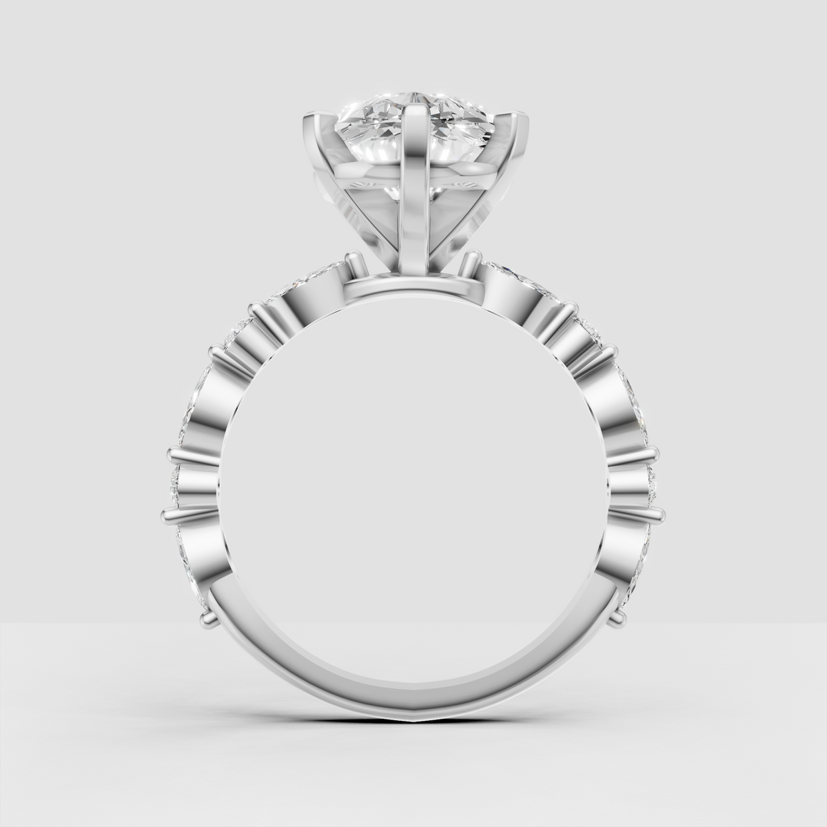 Modern pear diamond engagement ring with sculptural shoulders