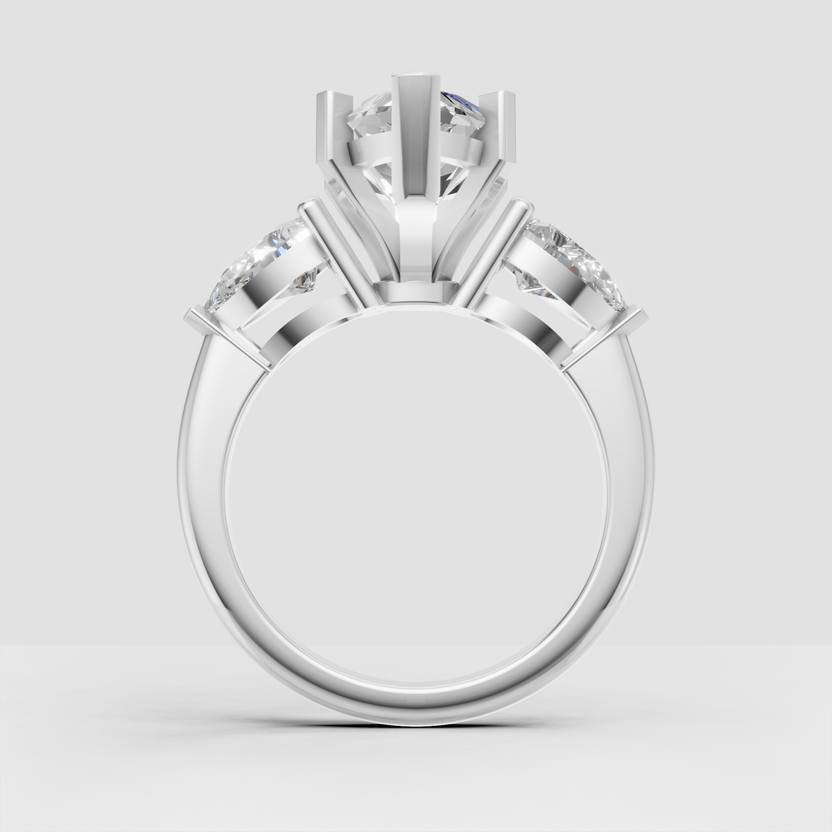 Classic three stone diamond ring with marquise center