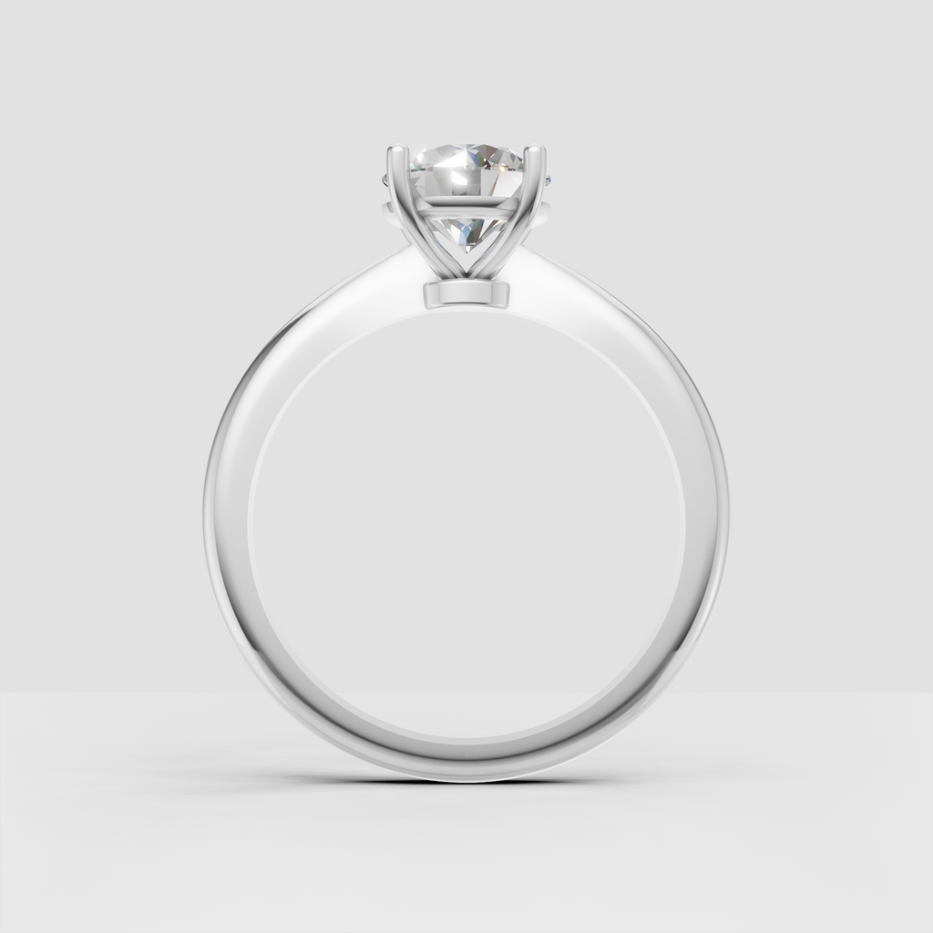 Classic yellow gold solitaire ring featuring a brilliant round center diamond