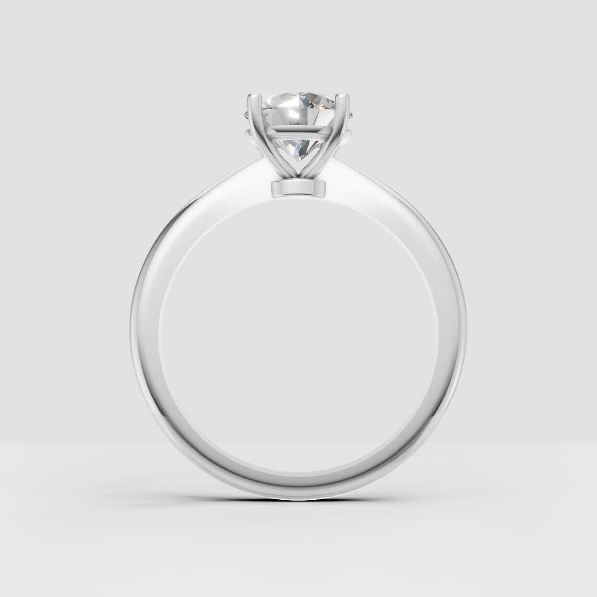 Classic yellow gold solitaire ring featuring a brilliant round center diamond