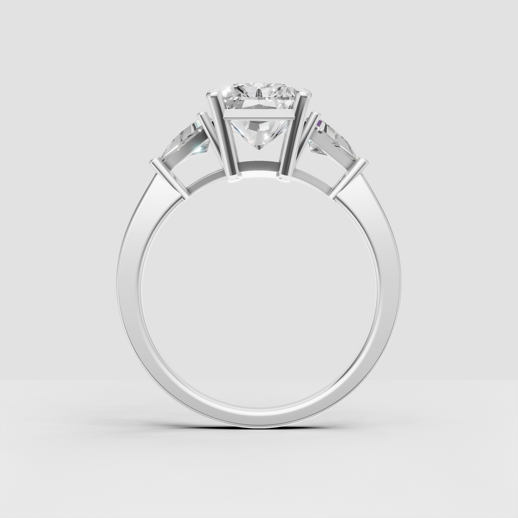 Radiant center diamond ring with tapered side stones and polished yellow gold band
