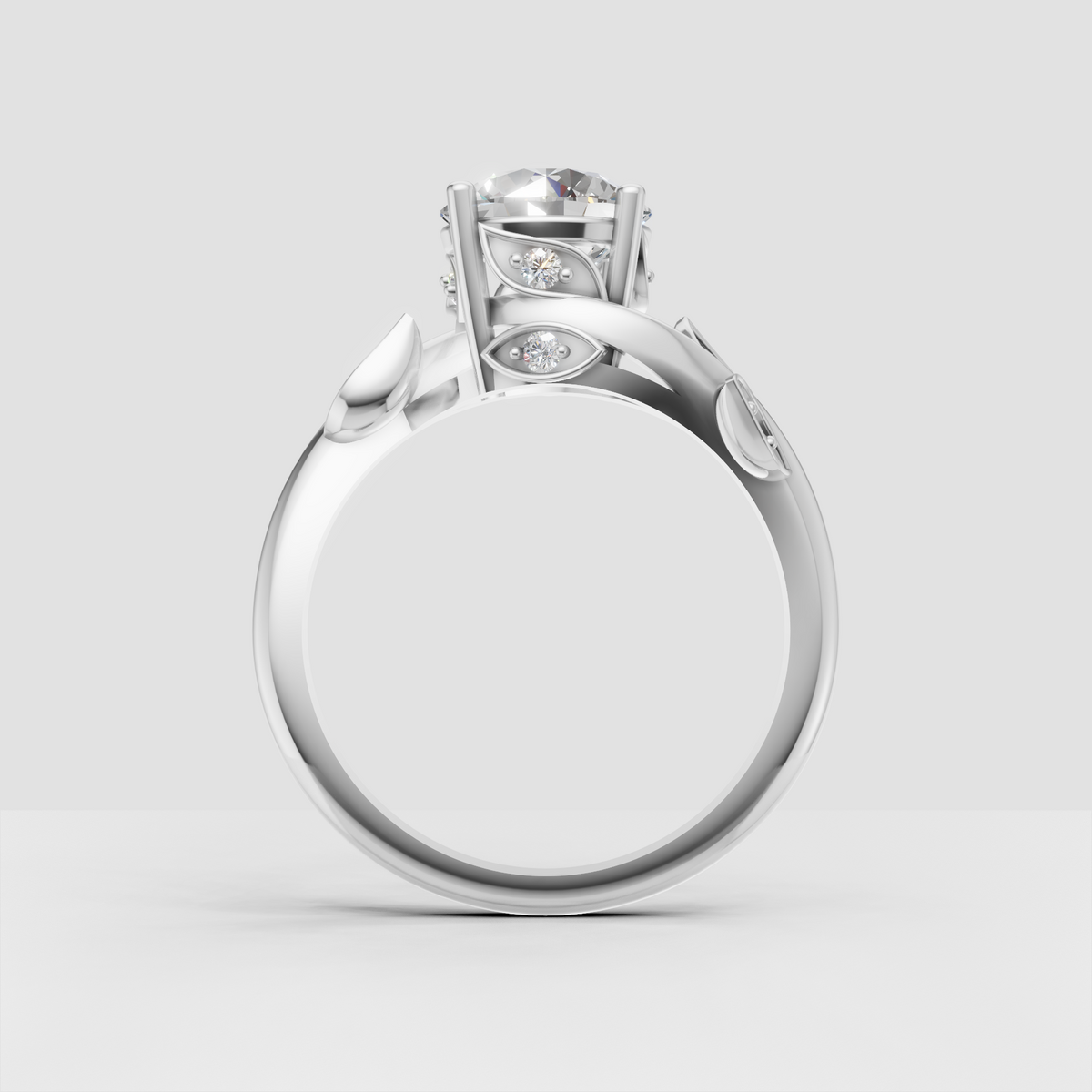Botanical engagement ring with sculpted leaf motifs