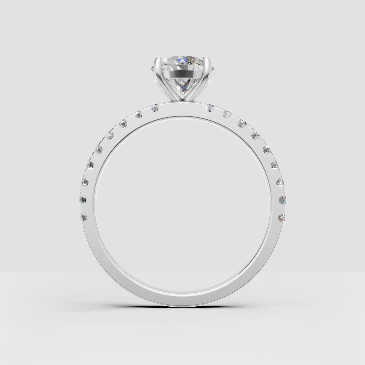 Round diamond engagement ring with continuous pavé accents