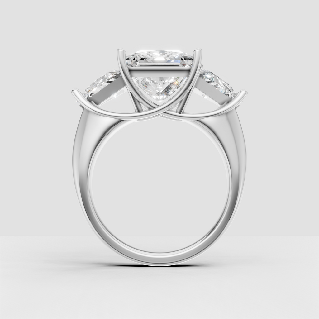 Princess cut center diamond with triangular side stones in gold