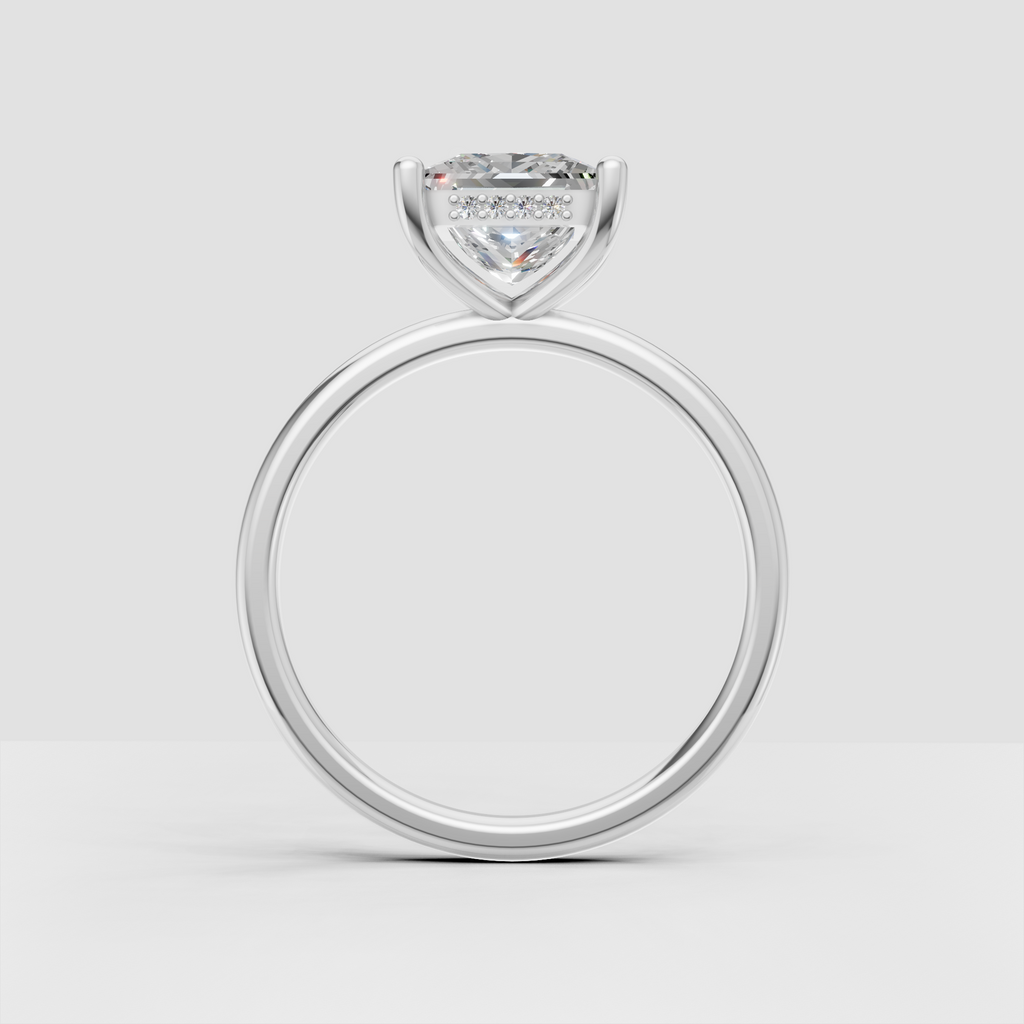 Detailed princess cut diamond engagement ring showing four-prong setting and sparkling under-gallery accents