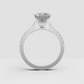 Elegant emerald diamond ring in yellow gold with pavé shoulders