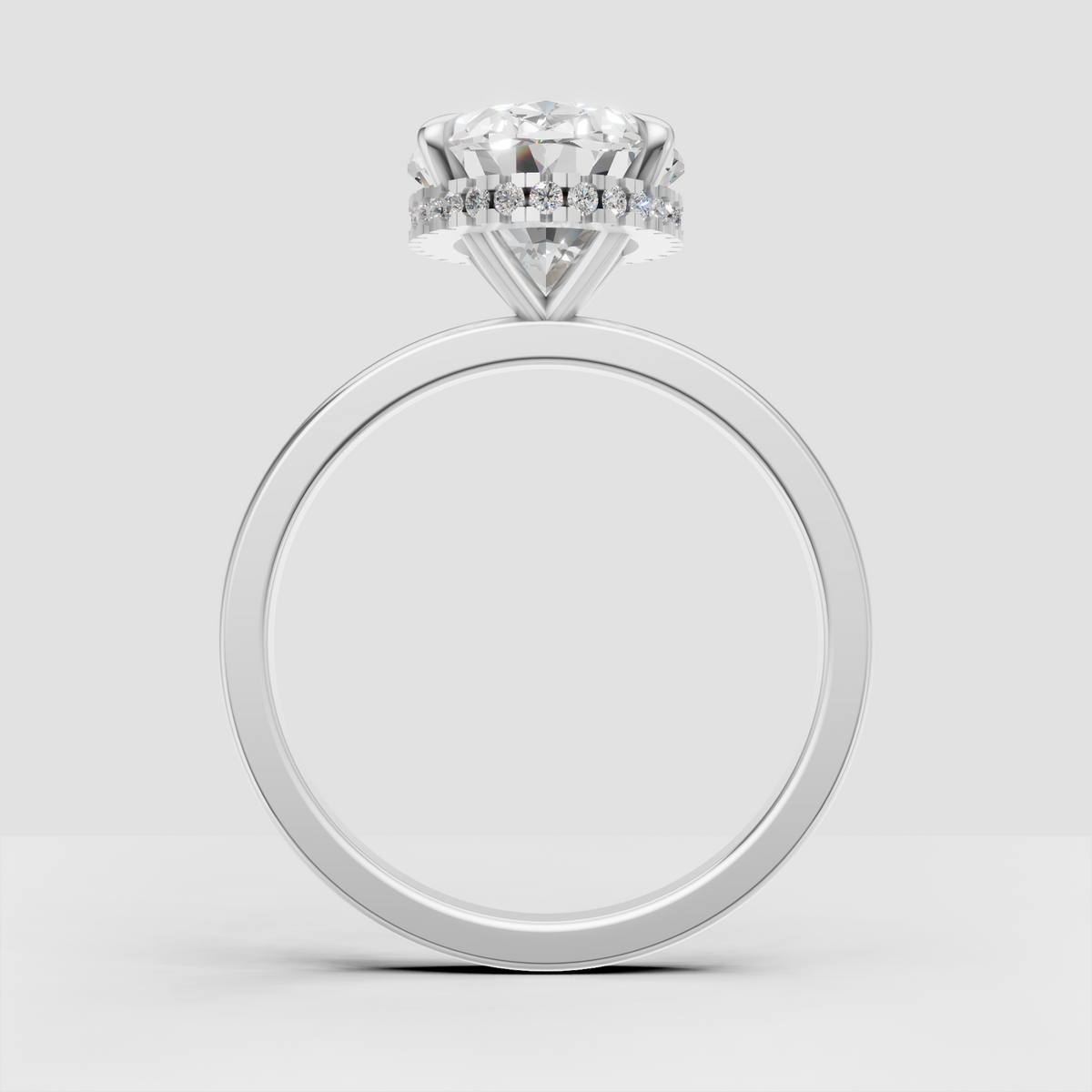 Oval diamond ring with round diamond hidden halo