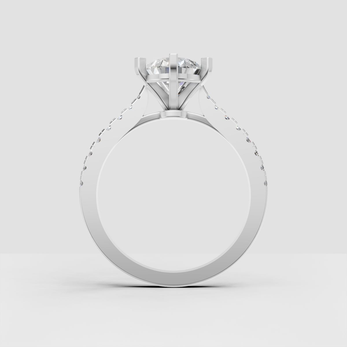 Front view of pear-shaped diamond engagement ring with pavé band