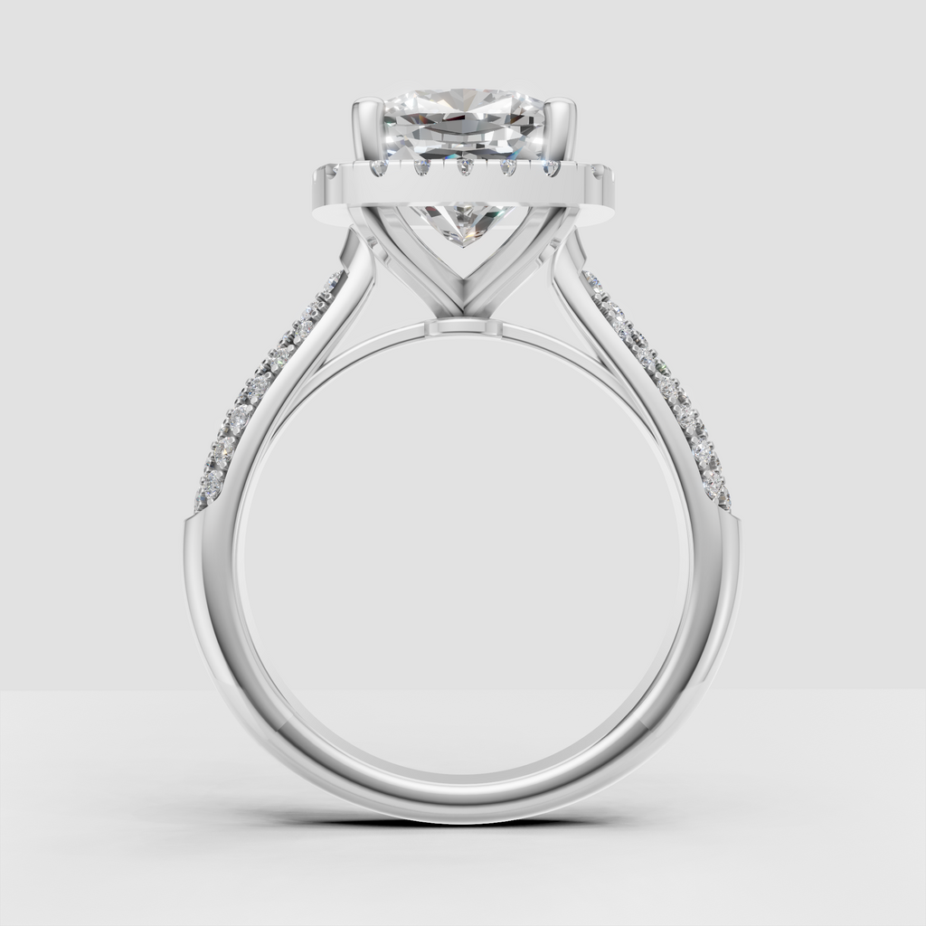 Cushion diamond engagement ring with round stone halo detailing