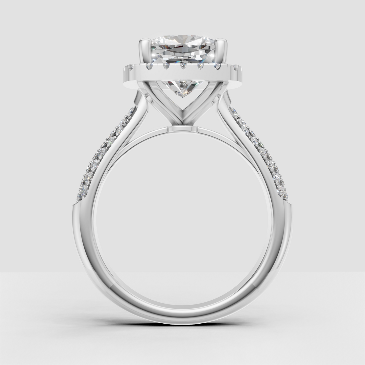 Cushion diamond engagement ring with round stone halo detailing