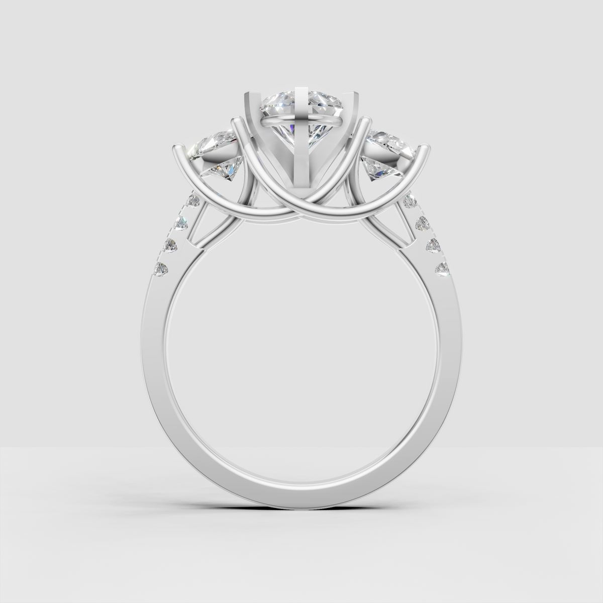Pear center stone engagement ring featuring sculptural yellow gold prongs