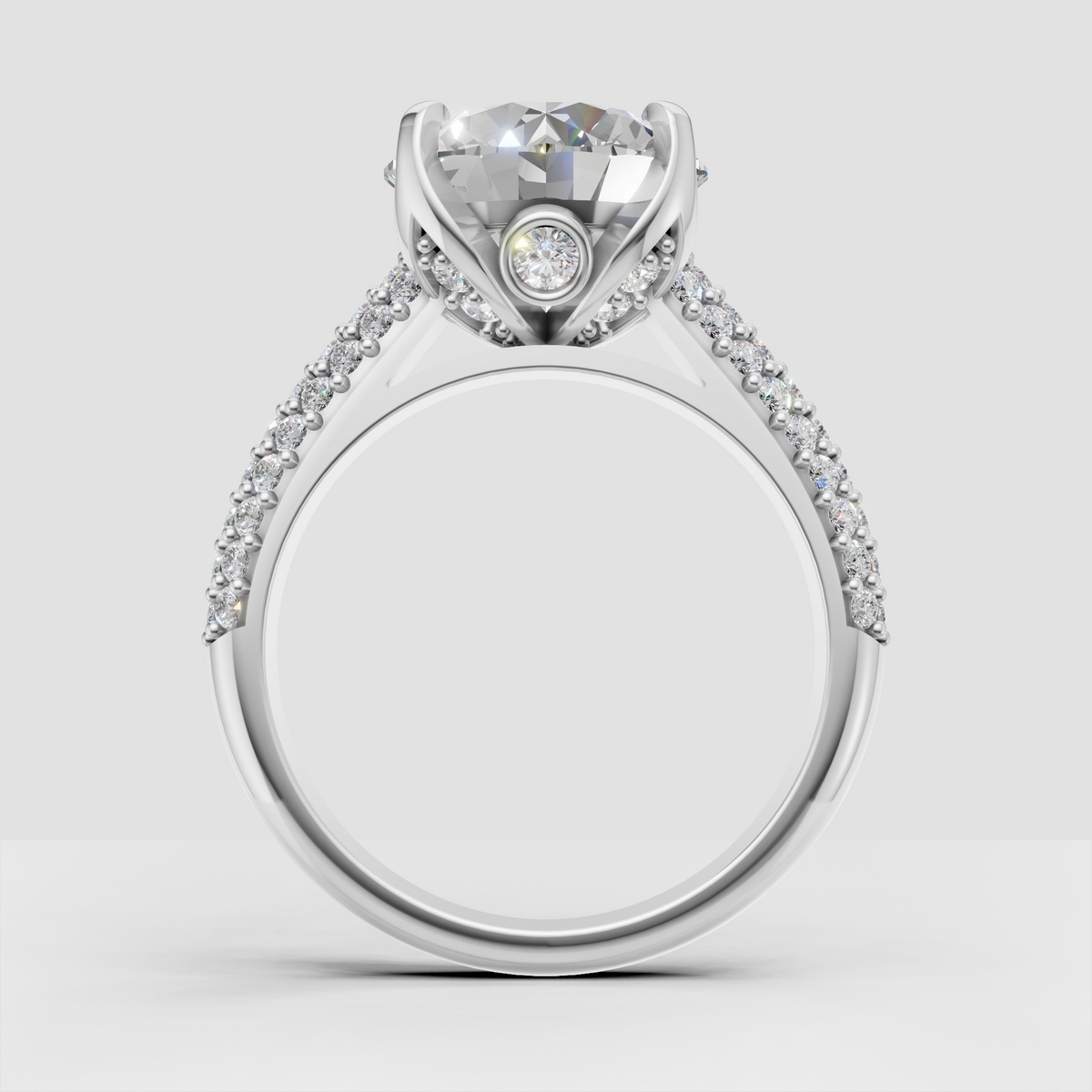 Round brilliant center diamond ring with detailed pavé shoulders